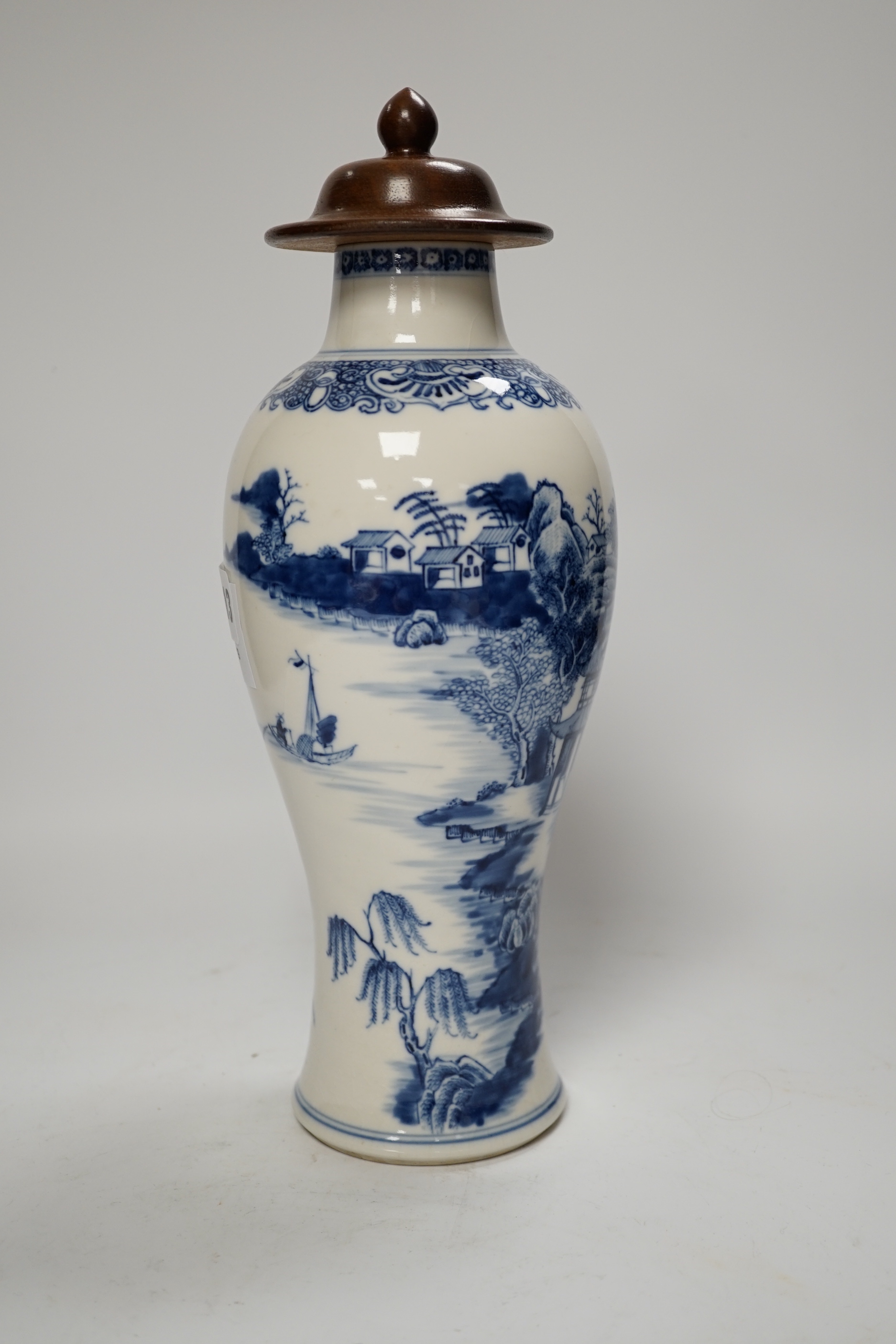 A Chinese Qianlong blue and white vase with wooden cover, 31.5cm